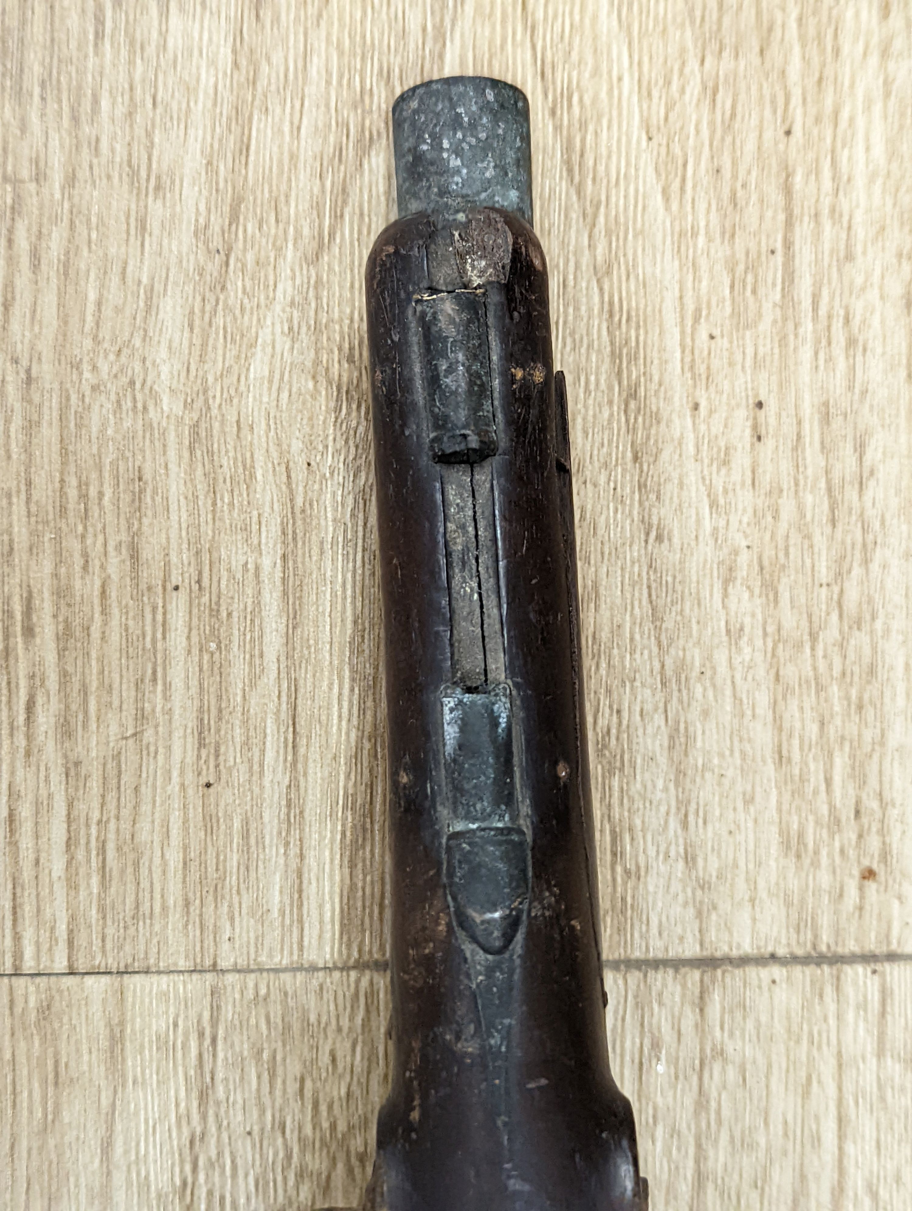 Two 19th century flintlock pistols and a pocket pistol, largest 40 cms long.